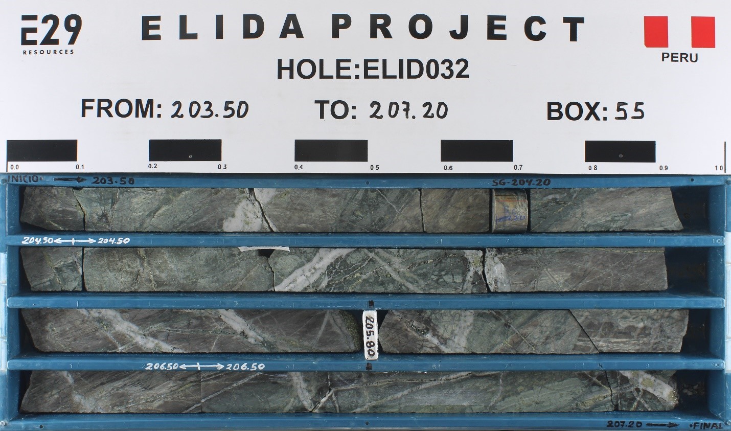 An example of porphyry style mineralization from hole ELID032. Strong, multiphase veinlets are developed in feldspathic sandstone host rock. Multiple generations of quartz and sulphide veinlets are visible. Hydrothermal potassium feldspar and biotite reveal a potassic environment of formation. Samples pertaining to core in this box are: 202.5-204.5 m, 0.85% Cu, 0.022% Mo, 6.0 g/t Ag; 204.5-206.5 m, 0.89% Cu, 0.029% Mo, 6.3 g/t Ag; 206.5-208.5 m, 0.85% Cu, 0.047% Mo, 5.8% Ag. Core is HQ diameter (63.5 mm).